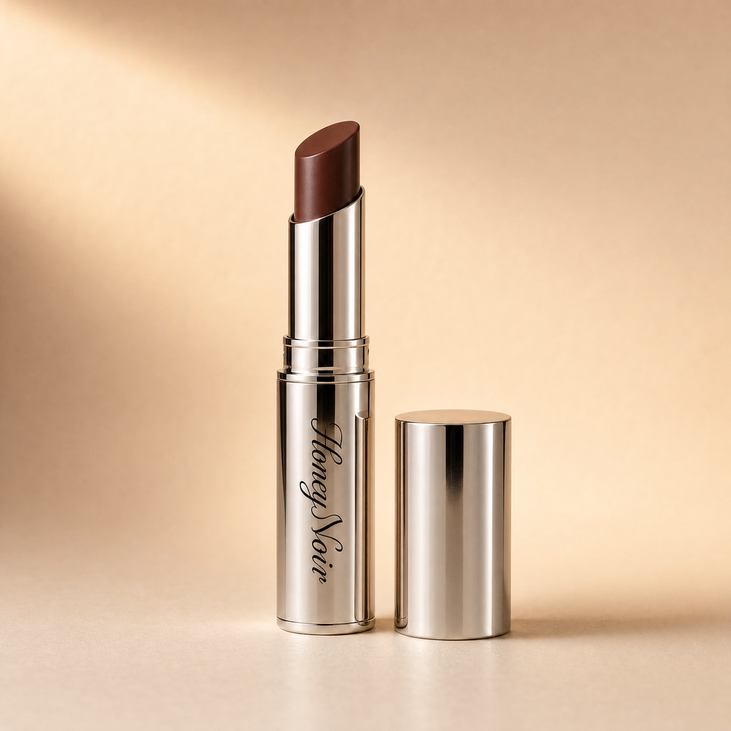 HZA™️ lipstick displayed against a warm neutral background